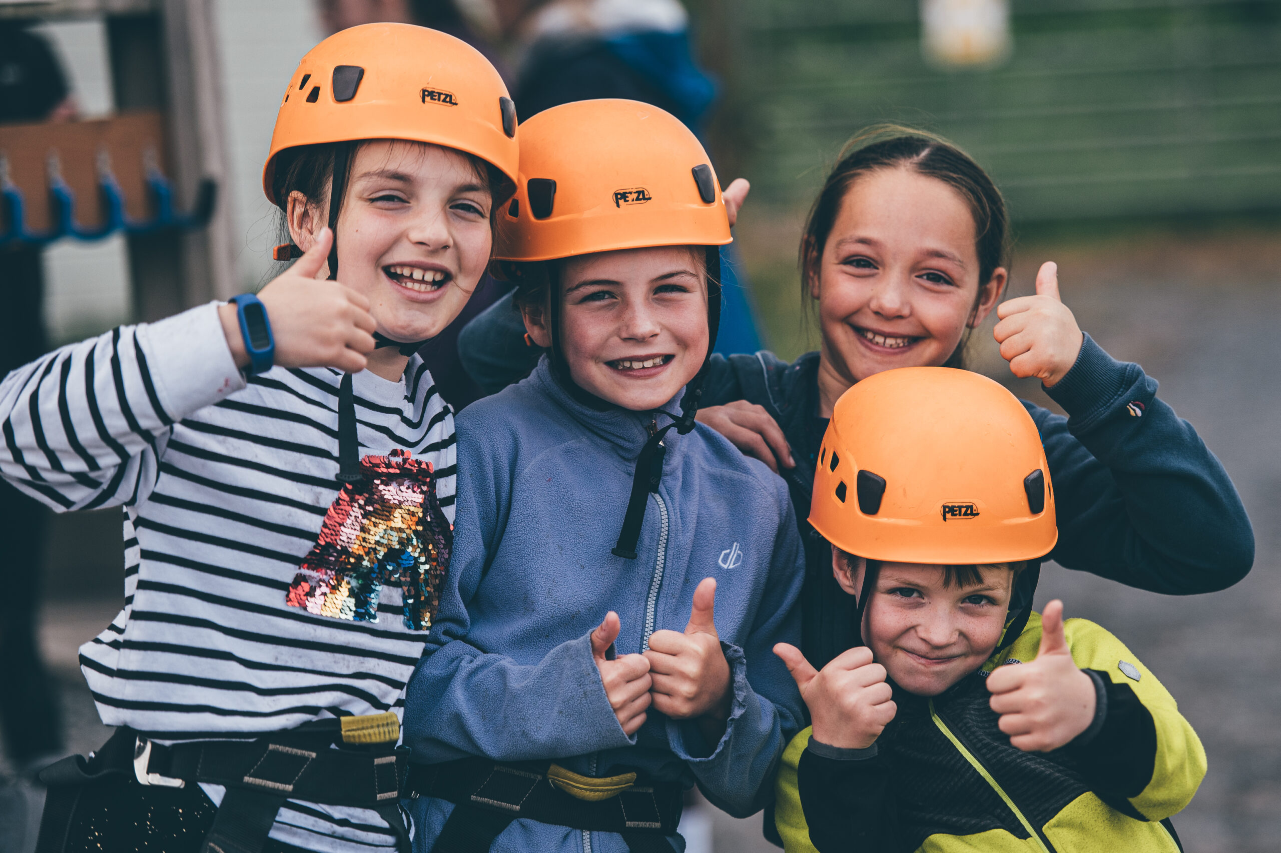 Children in their safety hats enjoying Llangrannog activities